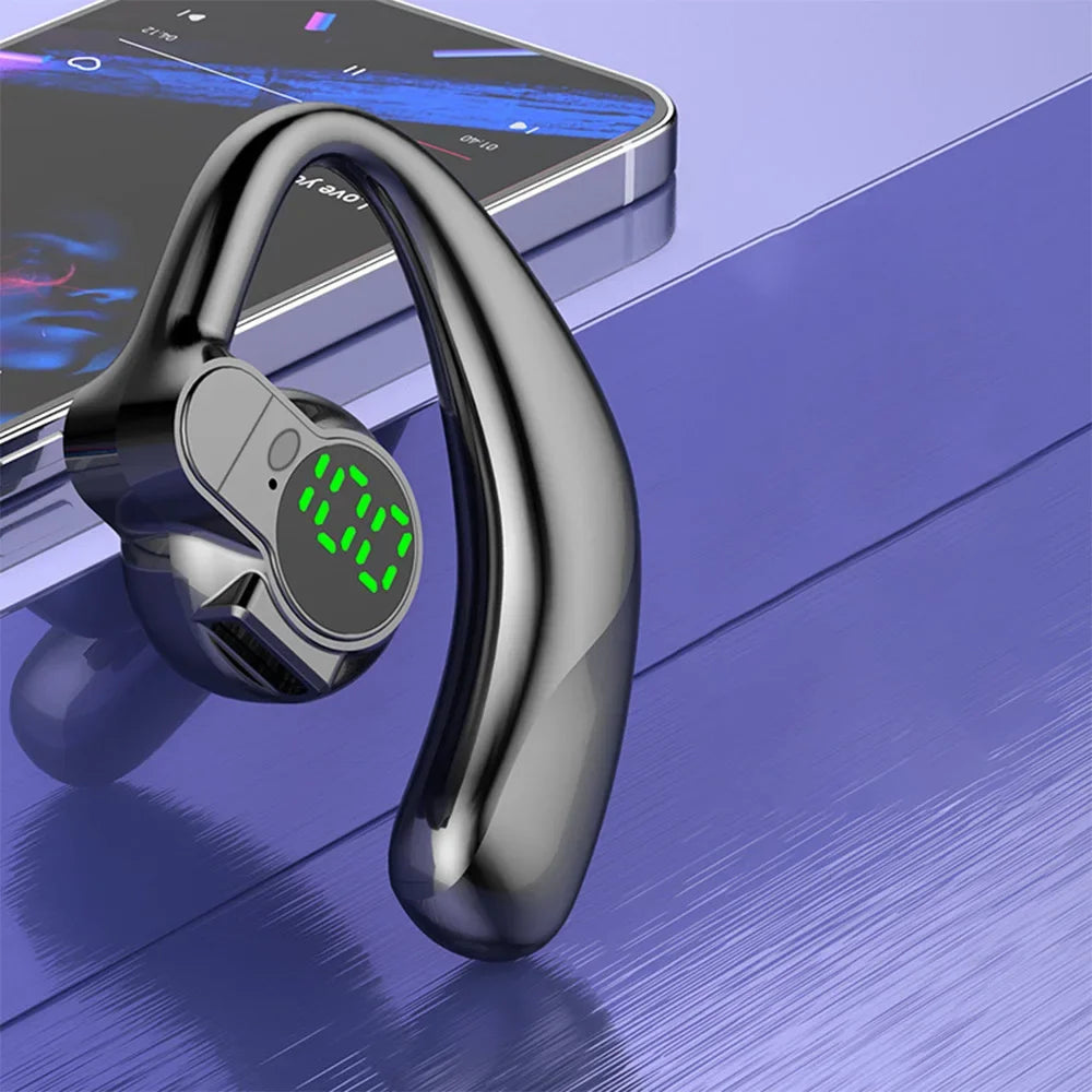 Black wireless earbud with digital display on a reflective surface