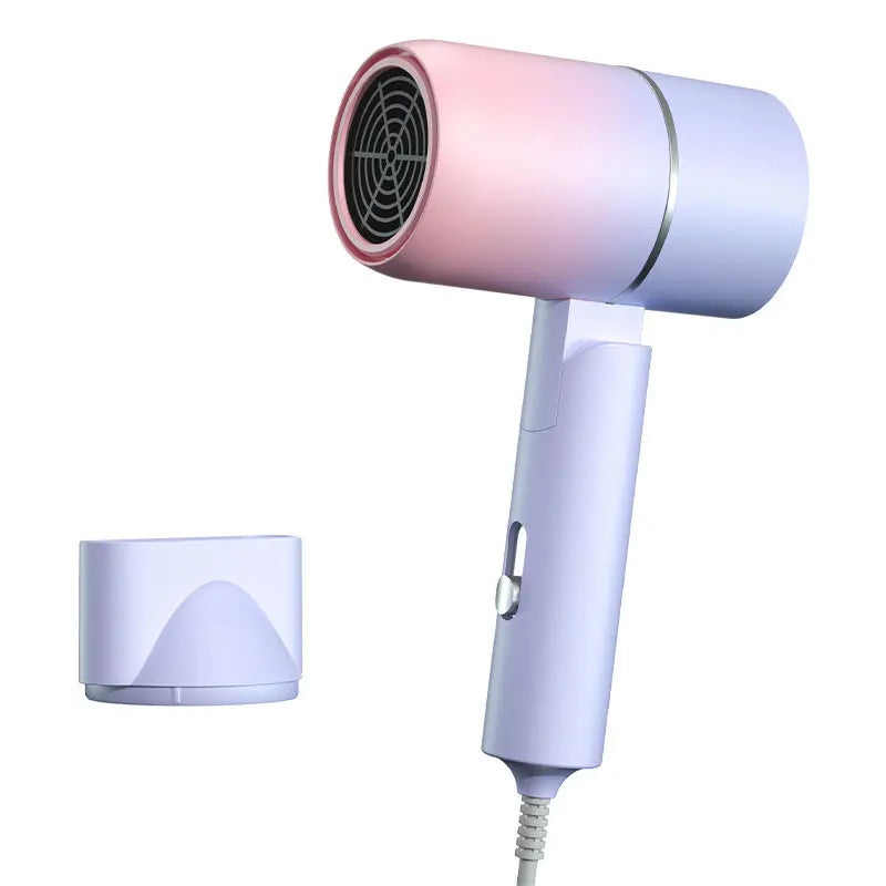 Pink and white hair dryer with a detachable nozzle on a white background