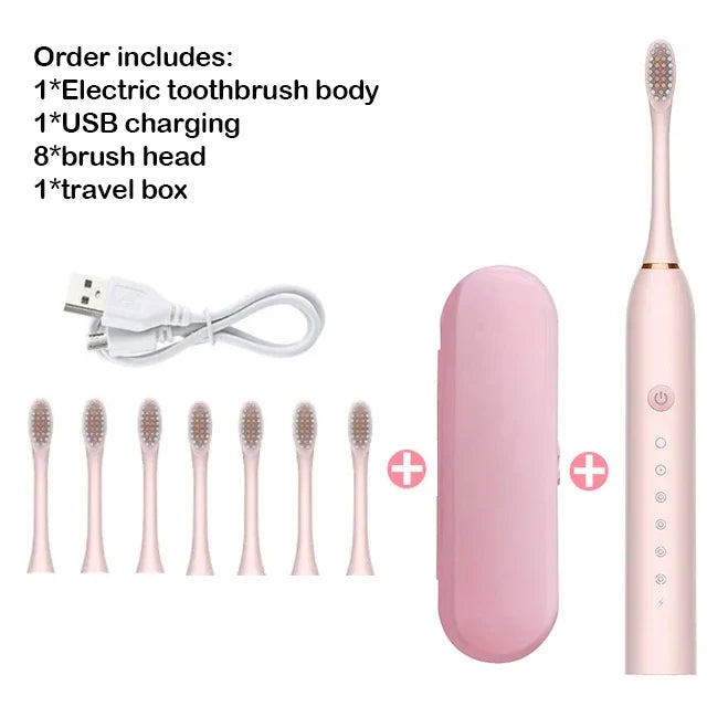 Pink electric toothbrush set with USB charging cable, travel box, and multiple brush heads on a white background.