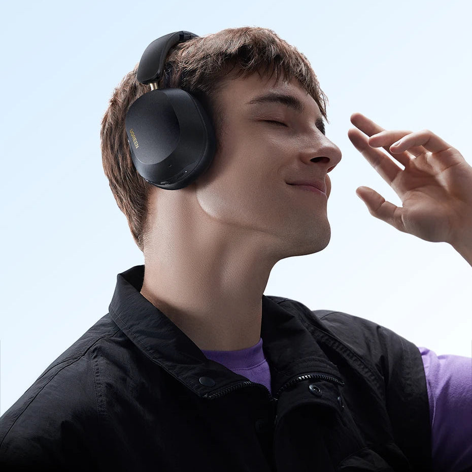 Person wearing noise-cancelling headphones with promotional text for Max5C headphones.