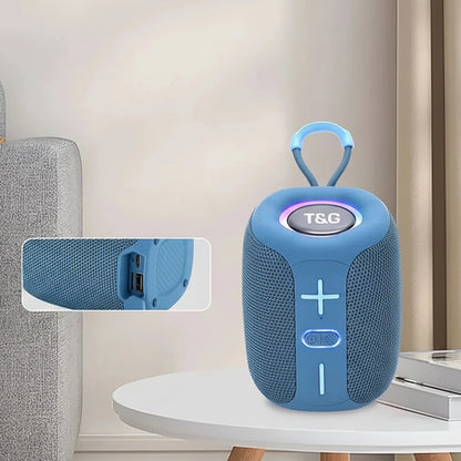 Blue portable speaker with T&G branding on a table, surrounded by text about its features.