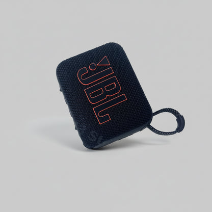 Black JBL speaker on a white background