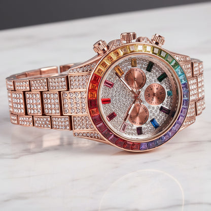Luxury watch with rose gold band and colorful face on a dark background