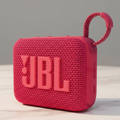 Red JBL portable speaker on a white background