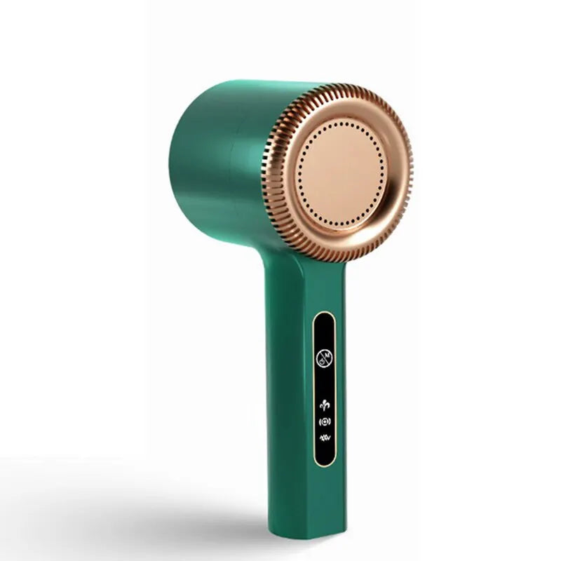 Green handheld lint remover with rose gold nozzle on a white background