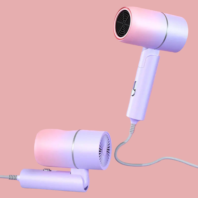 Pink and white hair dryer on a pink background