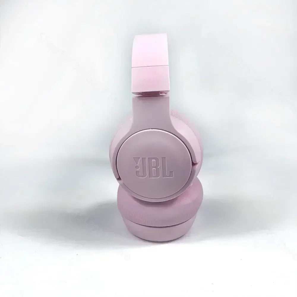 Pink JBL headphones on a white background