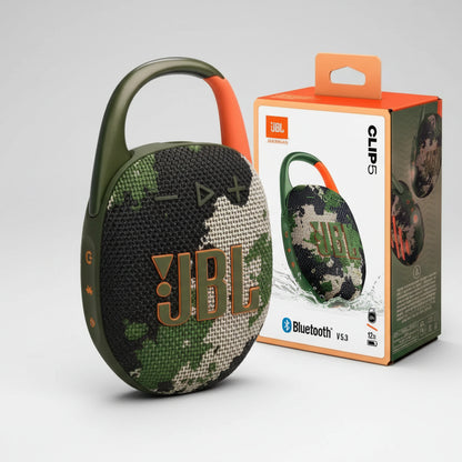 Camouflage JBL Clip 5 Bluetooth speaker with packaging on a white background