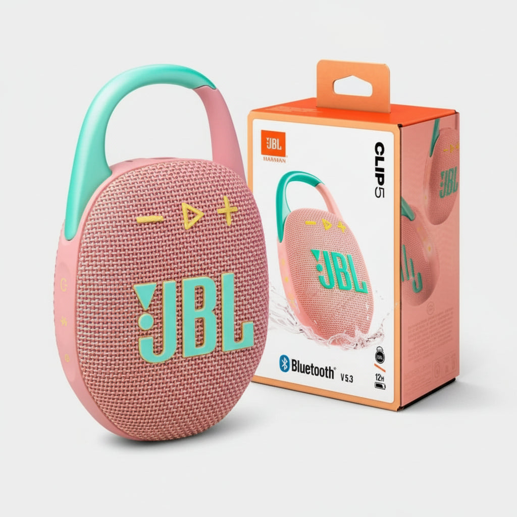 Pink JBL speaker with green handle and packaging on a white background