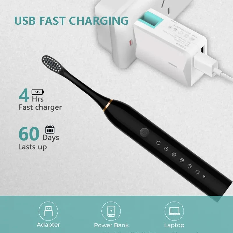 Black electric toothbrush with charging cable and adapter on a light gray background